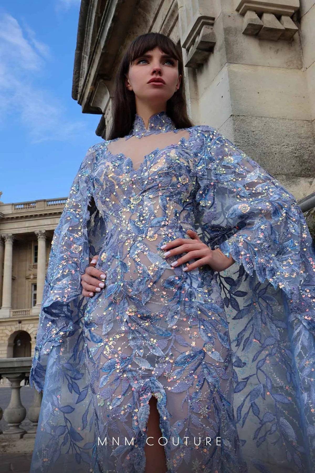 MNM Couture K4012 Blue Sheer Embellished Gown with Cape Sleeves - Image 2